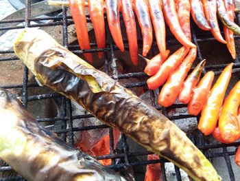 High angle view of meat on barbecue grill