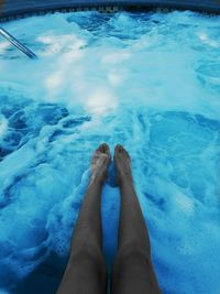 Low section of woman in swimming pool