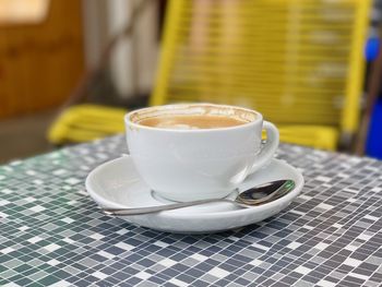 Close-up of coffee cup on table