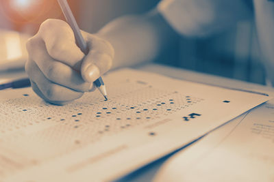 Close-up of man working on table