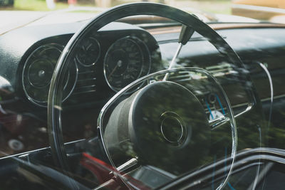 Retro car dashboard interior. view of the steering wheel and dashboard of an old vintag car