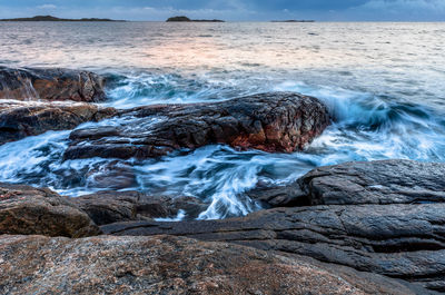 Sea waves splashing on rocks