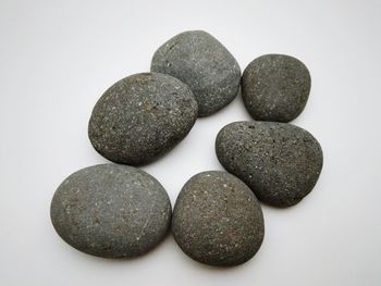 Close-up of stones against white background