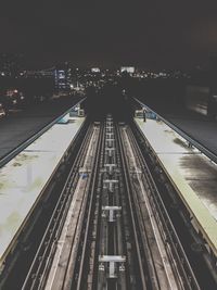 High angle view of railroad tracks at night
