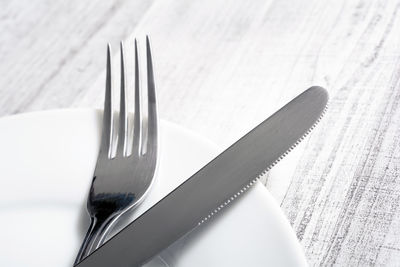 High angle view of fork on table