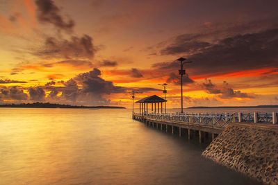 Scenic view of sea against orange sky
