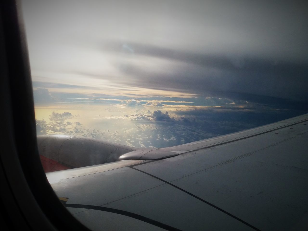 AERIAL VIEW OF CLOUDS SEEN THROUGH WINDOW