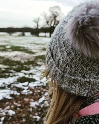 Portrait of woman in park during winter