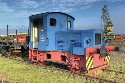 Train on railroad track against sky