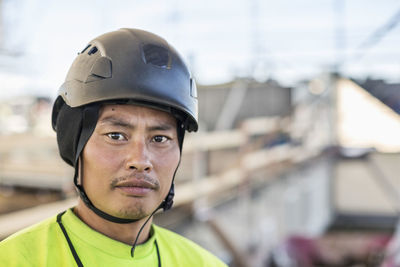 Portrait of confident construction worker at site