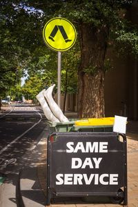 Information sign against trees