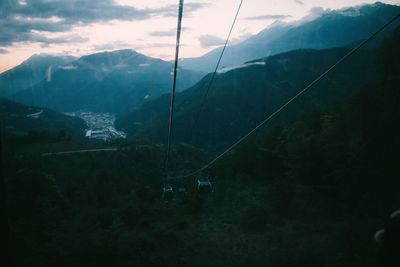 Overhead cable car against mountain range