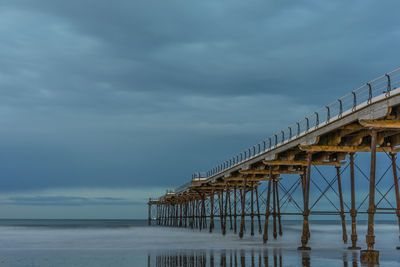 Pier over sea against sky