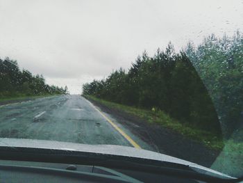 Country road seen through car windshield