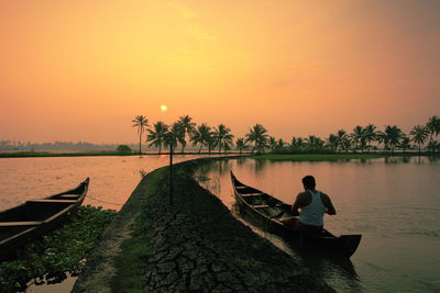 Scenic view of river at sunset