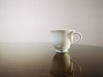 Close-up of coffee cup on table