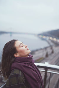 Portrait of a young woman looking away