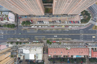 High angle view of road by buildings in city