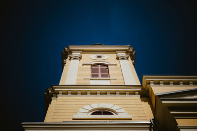 Low angle view of illuminated building against sky at night