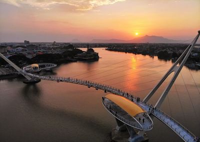 High angle view of bridge over river against sky during sunset
