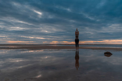 Yoga asanas on the background of dawn