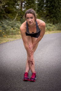 Woman exercising on road