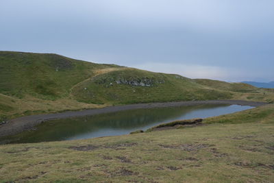 Scenic view of river against sky