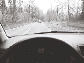 Cropped image of car on road