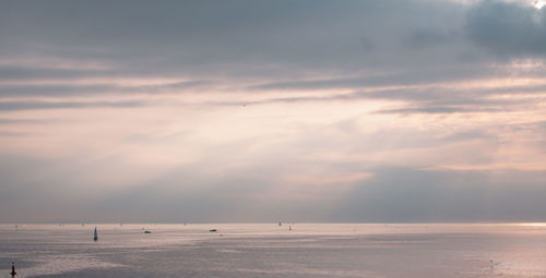 Scenic view of sea against sky at sunset