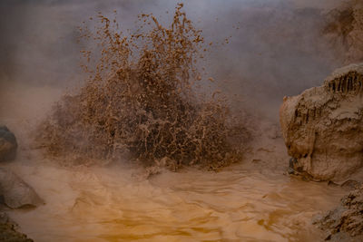 Scenic view of sea waves splashing on rocks