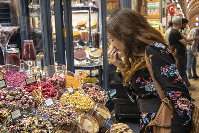 Midsection of woman at market stall