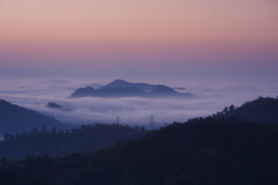 Scenic view of mountains against sky during sunset