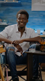 Man sitting on chair at table