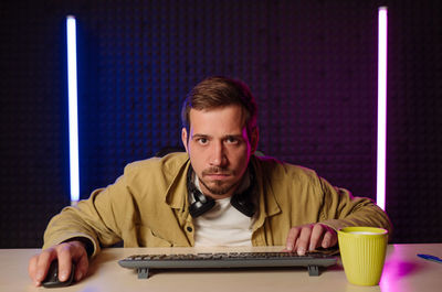 Young man using laptop at home