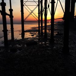 Scenic view of sea against orange sky