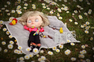 Portrait of cute girl playing with flowers