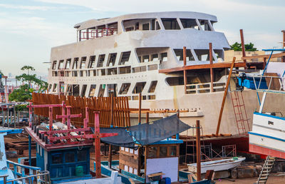 Boats moored at harbor