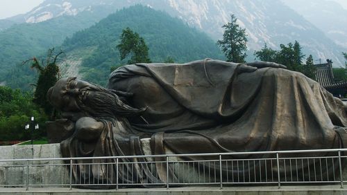 Statue against mountain