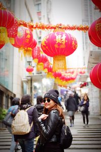 Woman in sunglasses standing at market