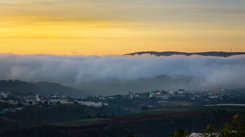 Scenic view of mountains against sky during sunset