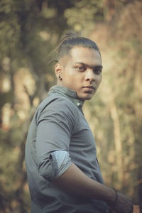 Portrait of young man standing outdoors