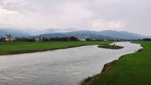 Scenic view of river against sky