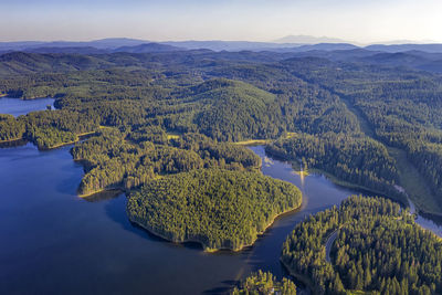 Scenic view of river and mountains against sky