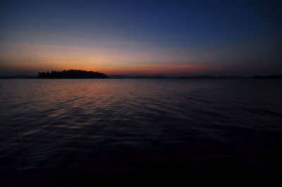 Scenic view of sea against sky at sunset