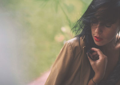 Close-up of young woman looking away