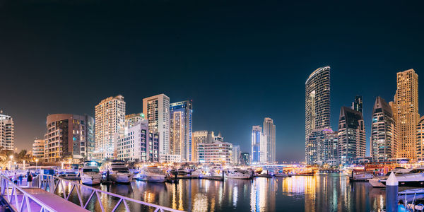 Illuminated buildings in city at night