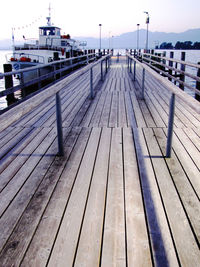 Pier over sea against sky