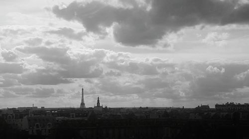 View of city against cloudy sky