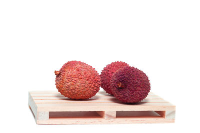 Close-up of fruits against white background