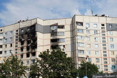 Low angle view of destroyed buildings in city